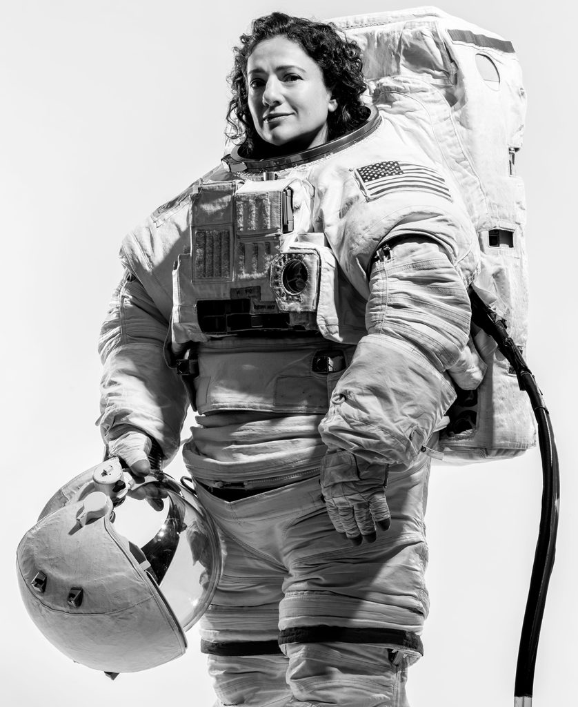 Jessica Meir ’99 poses in her spacesuit